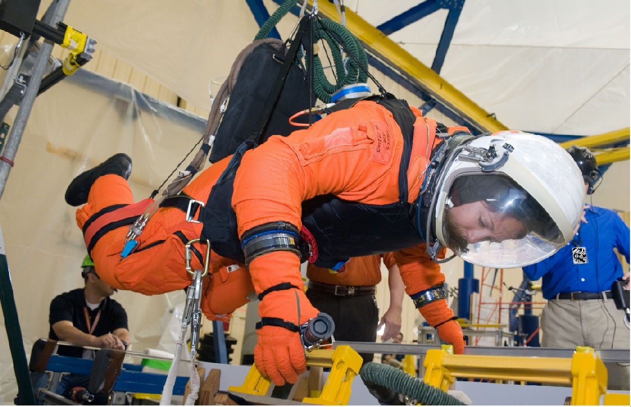 A NASA astronaut trains for a future mission task that will be conducted in a weightless environment, using the ARGOS system.